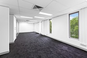 Carpeted Open Plan Office Space with Natural Light